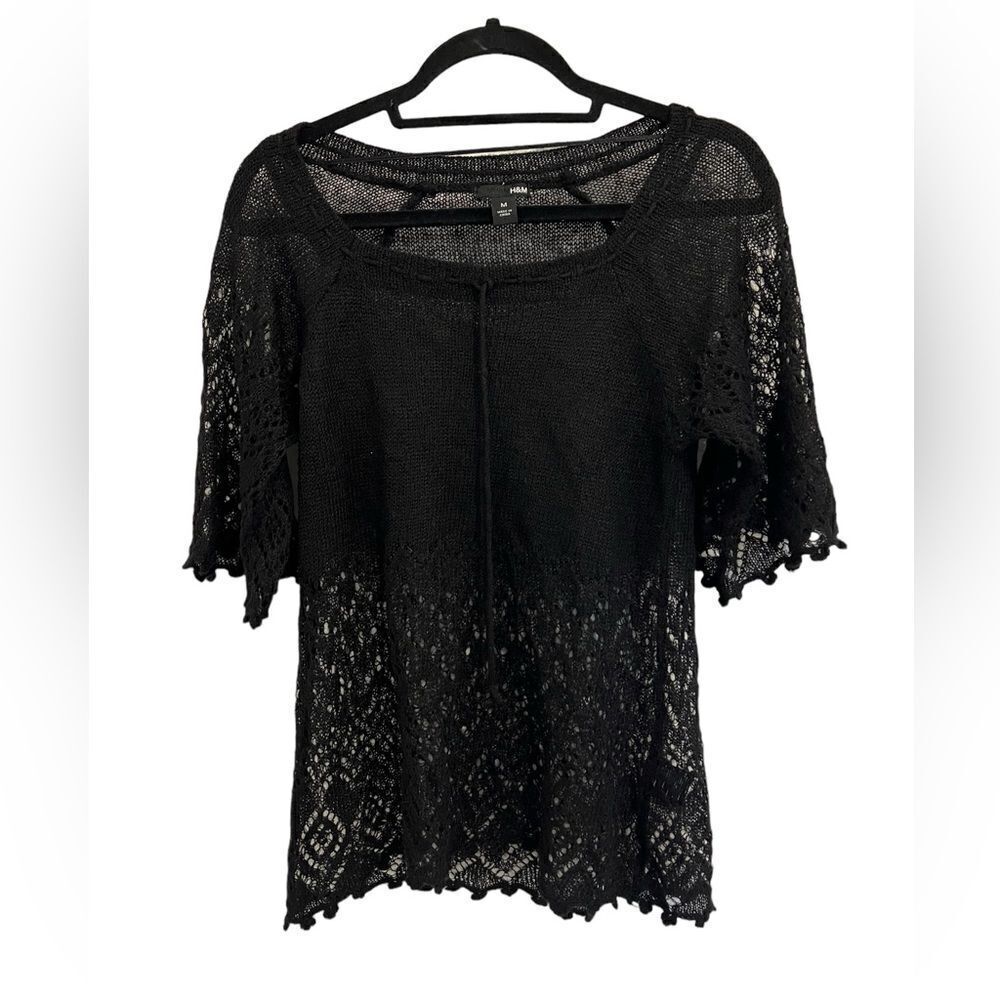 Black sweater with crochet detailing